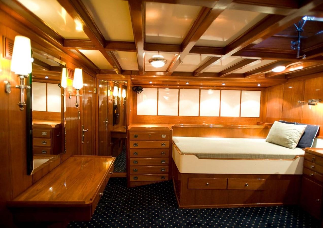 a room with a bed and a desk aboard CANDIDA Yacht for Sale