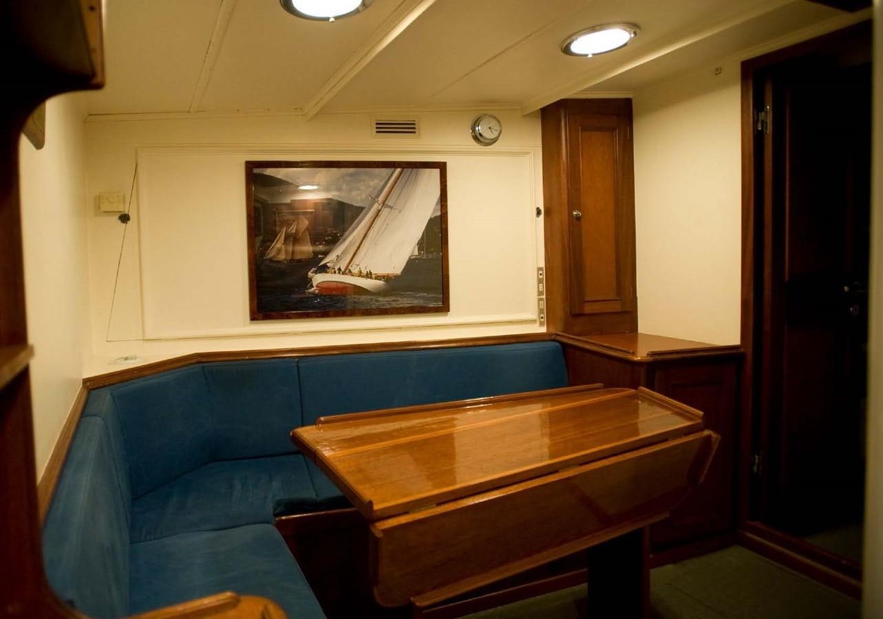 a room with a table and a bench aboard CANDIDA Yacht for Sale