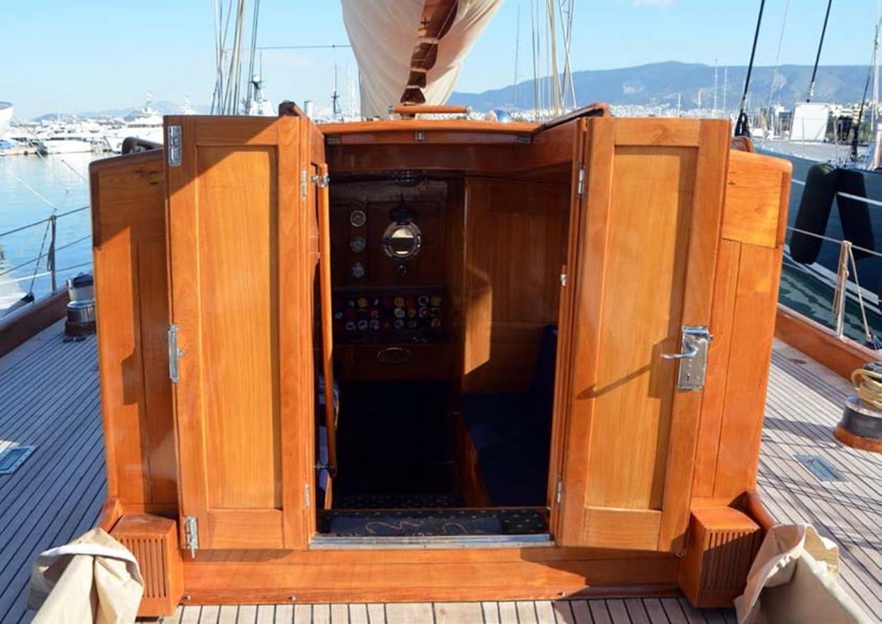 a wooden cabinet on a deck aboard CANDIDA Yacht for Sale