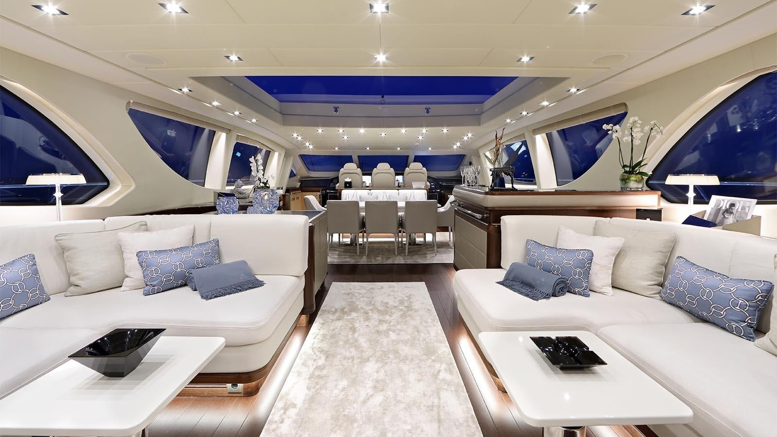 a room with a couch and a table aboard YOU & G Yacht for Sale