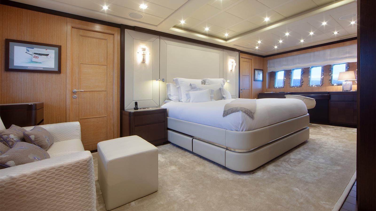 a large bedroom with a bed aboard YOU & G Yacht for Sale