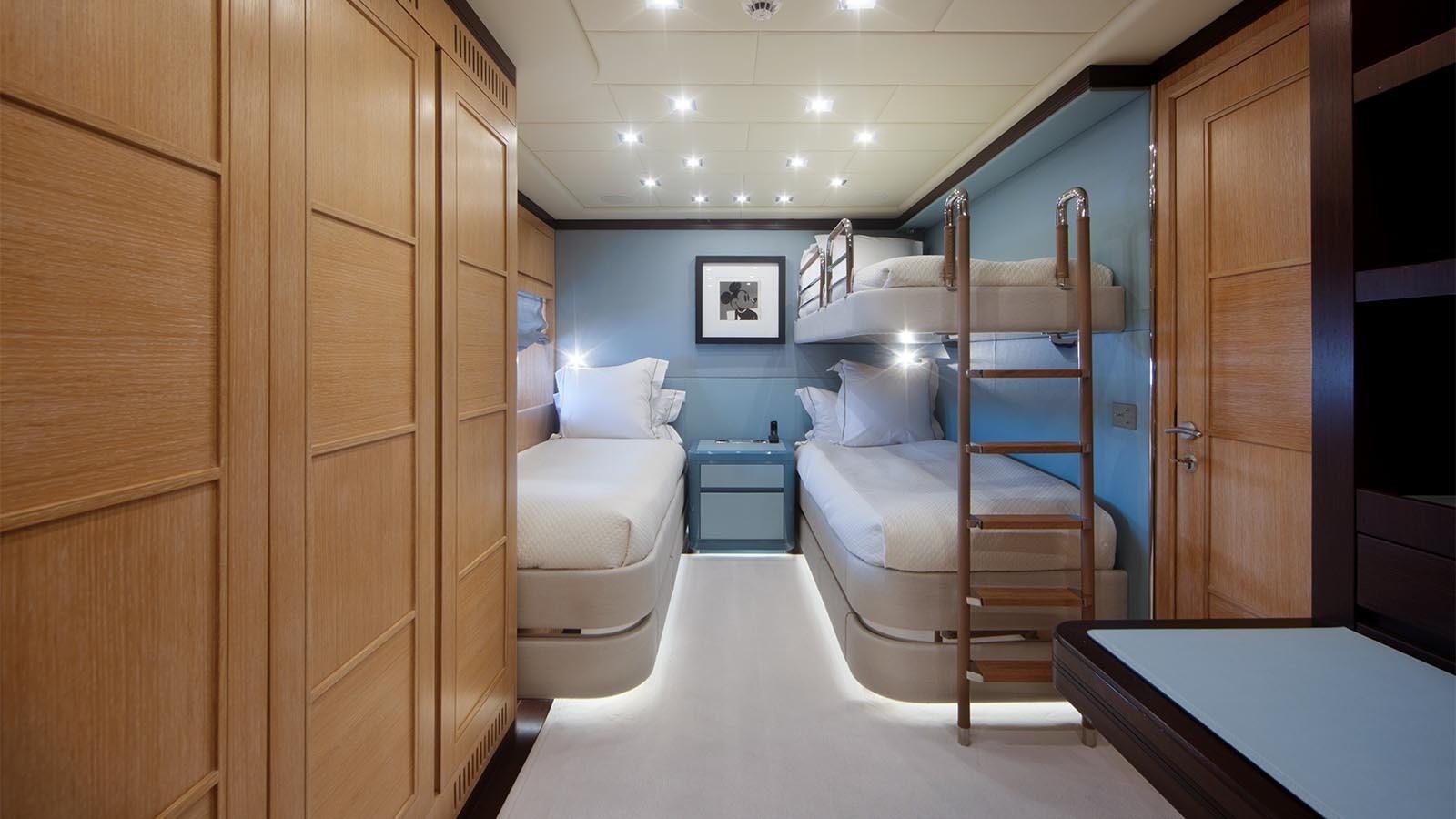 a room with a bed and a desk aboard YOU & G Yacht for Sale