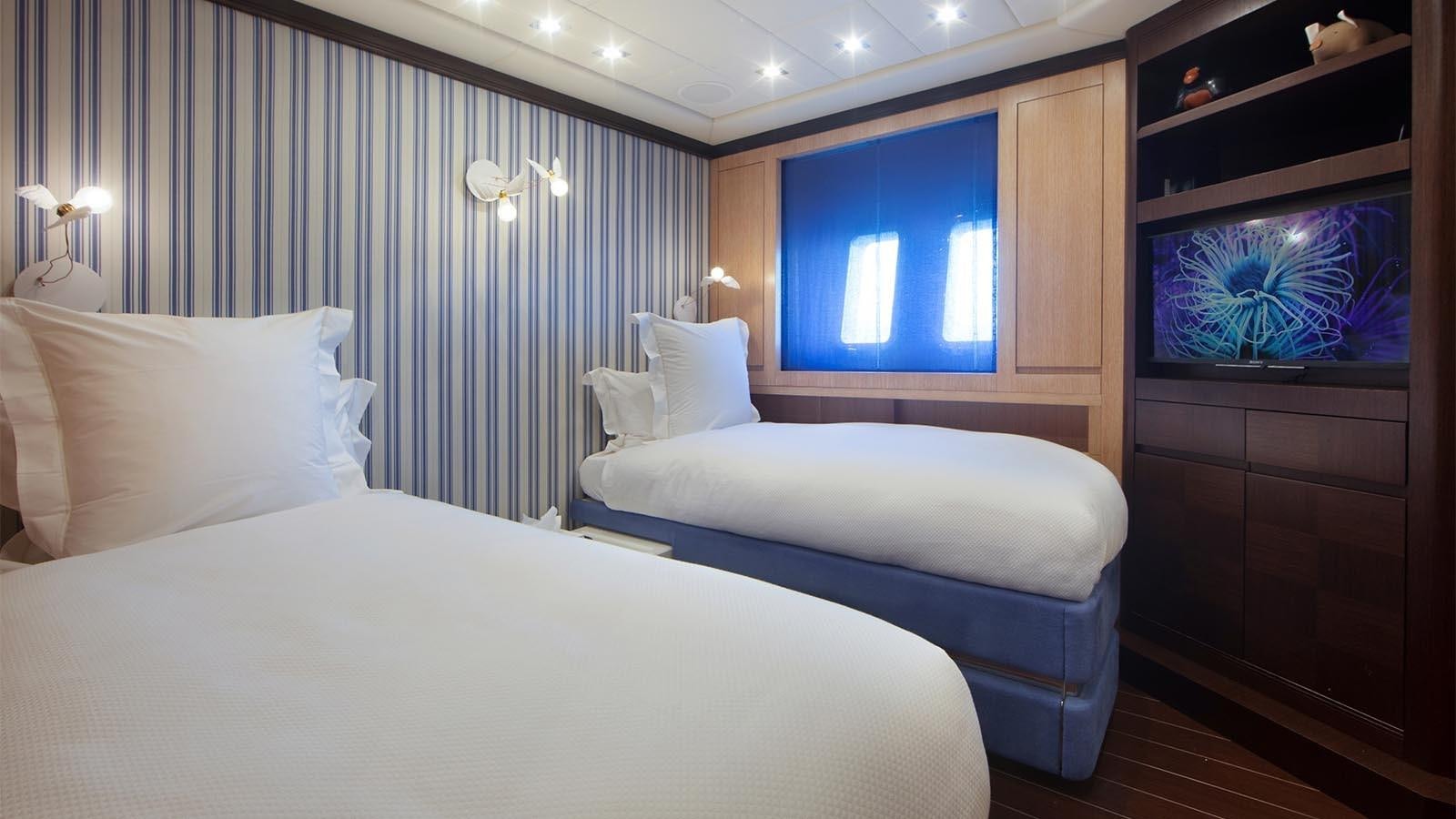 a room with two beds aboard YOU & G Yacht for Sale
