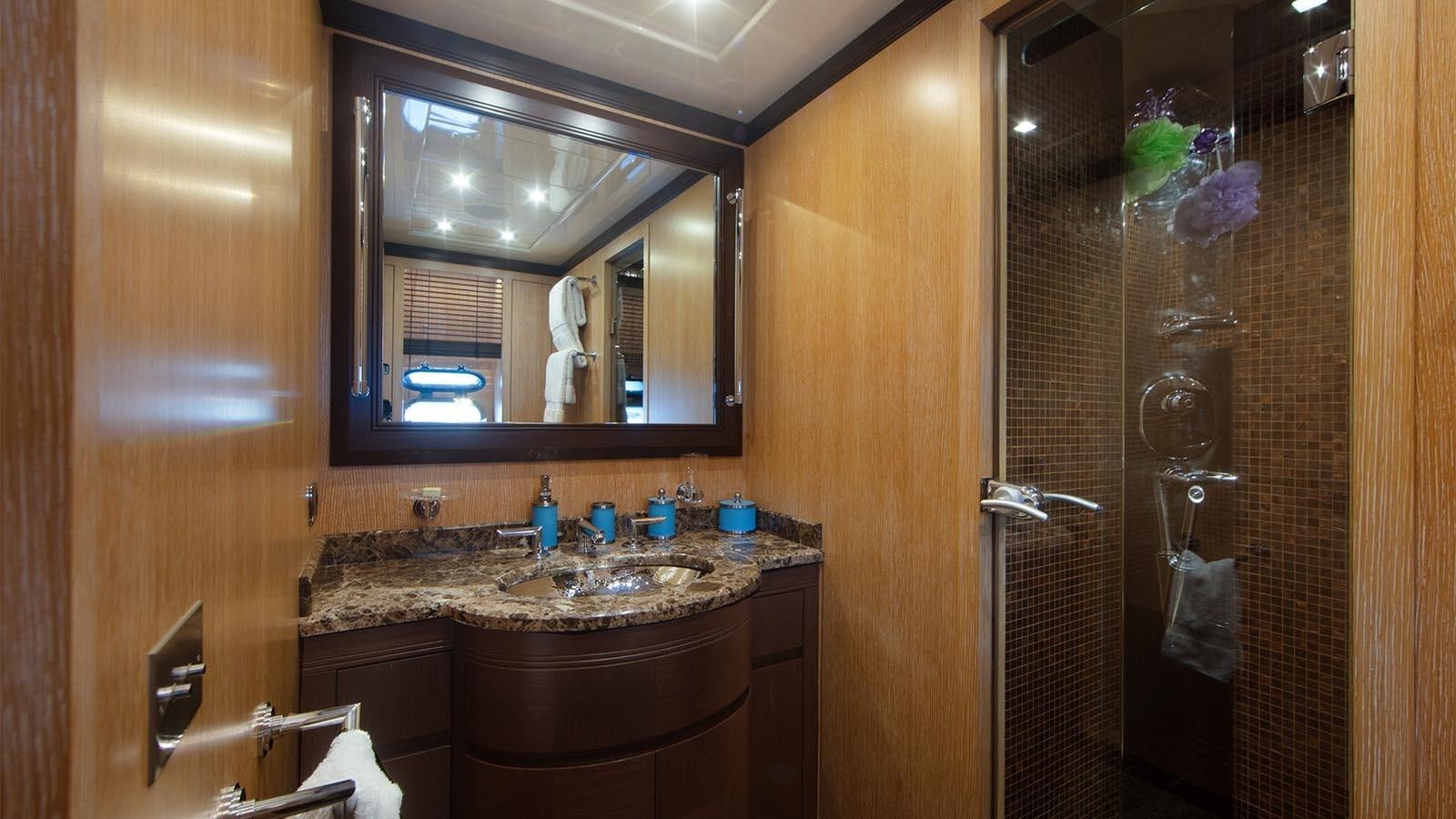 a bathroom with a marble counter top aboard YOU & G Yacht for Sale