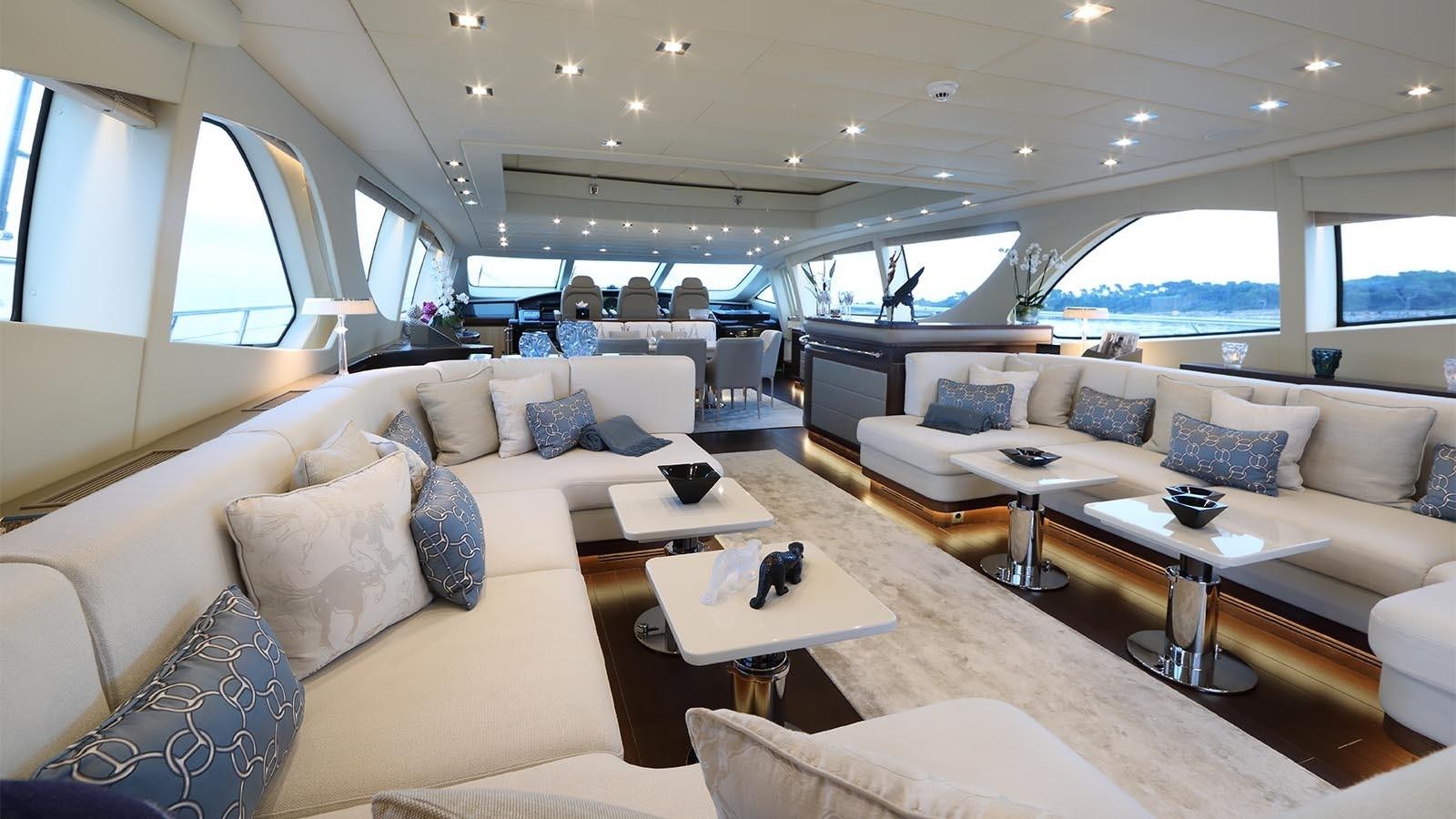 a living room with a couch and a coffee table aboard YOU & G Yacht for Sale