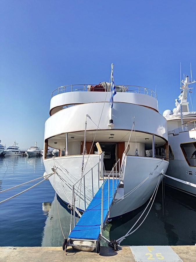 a boat docked at a pier aboard ELIKI Yacht for Sale