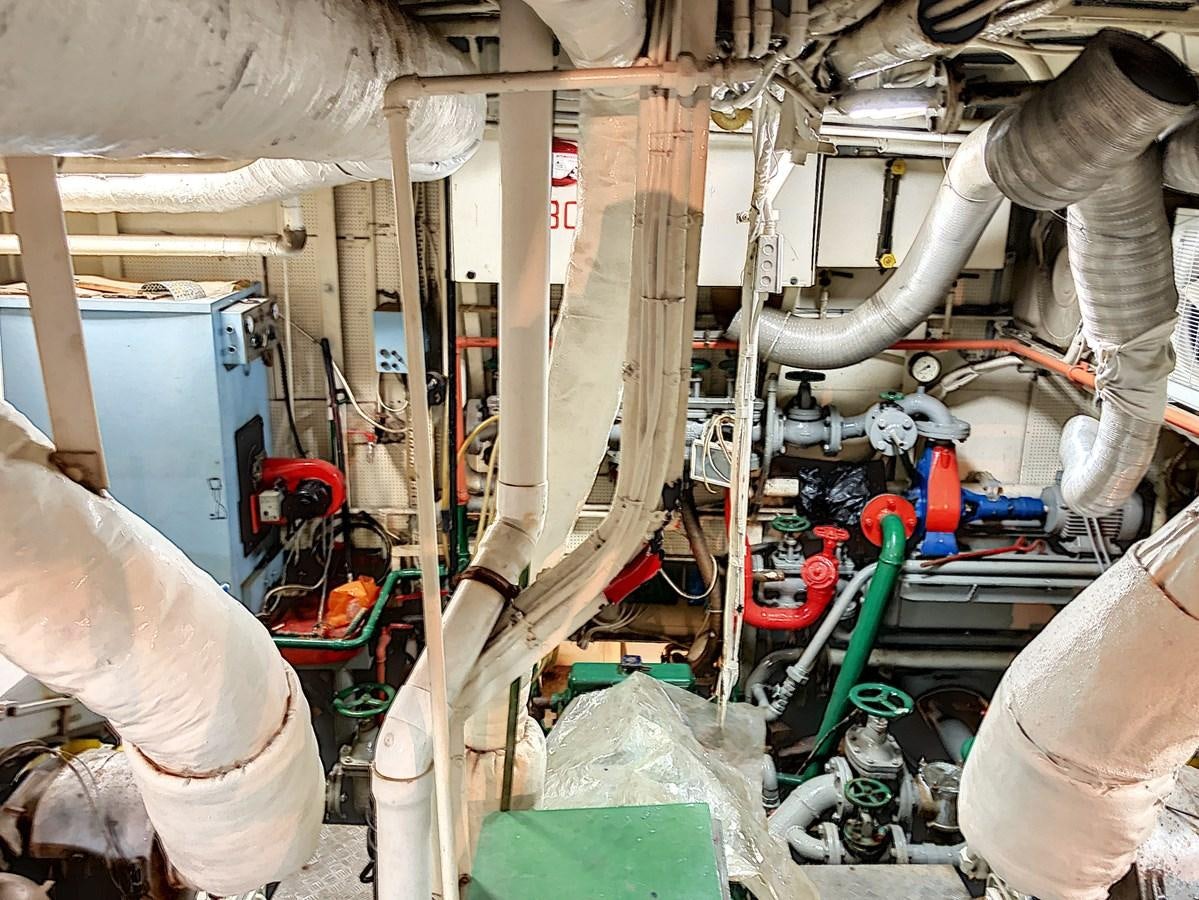 a room with several pipes aboard ELIKI Yacht for Sale