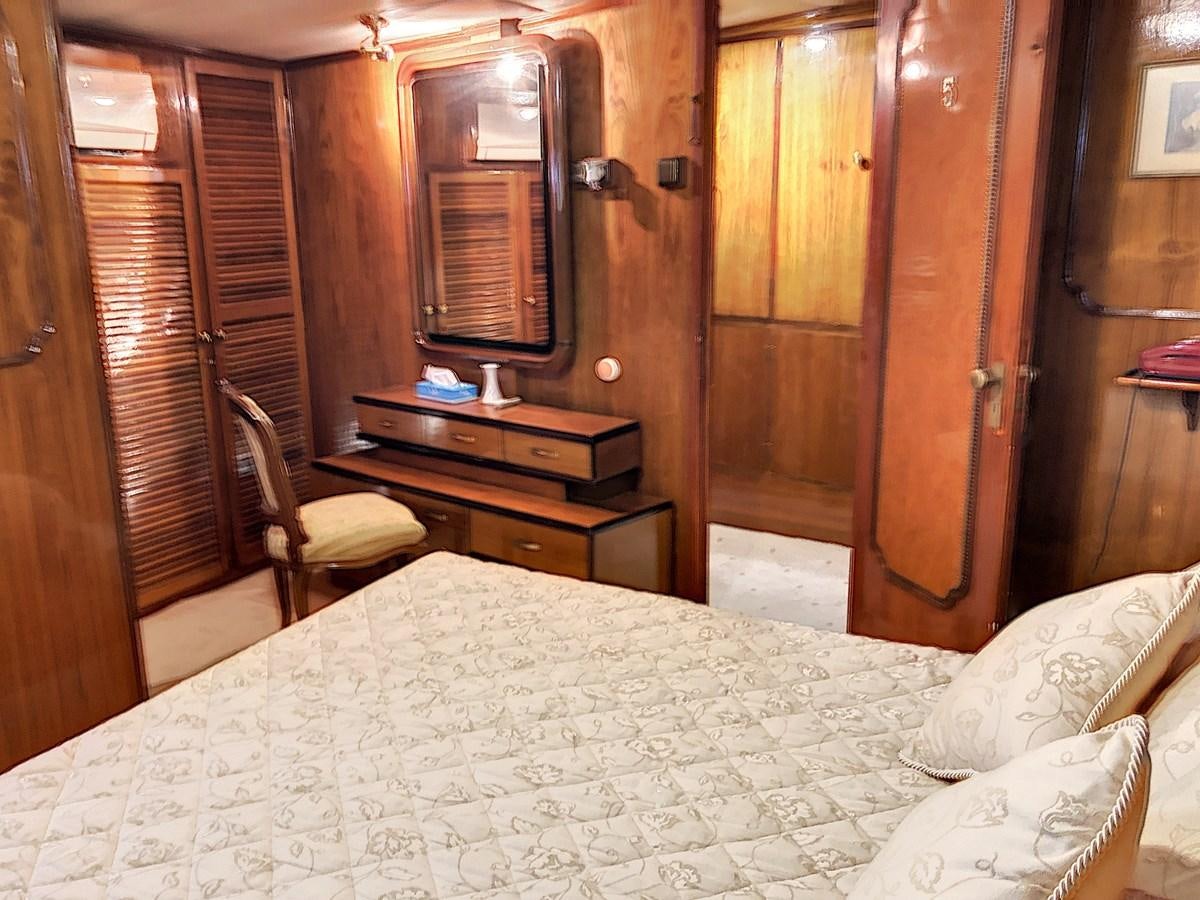 a bed in a room aboard ELIKI Yacht for Sale