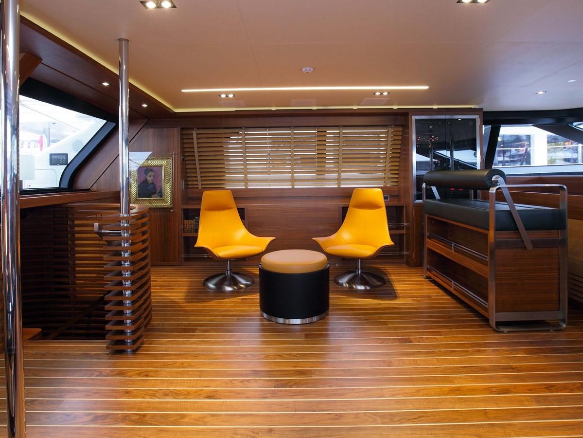 a room with chairs and a table aboard STATE OF GRACE Yacht for Charter