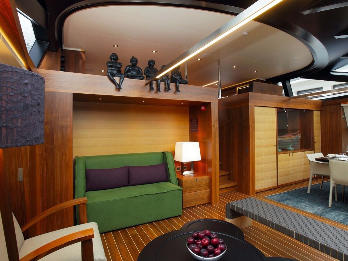 a room with a couch and a table aboard STATE OF GRACE Yacht for Charter