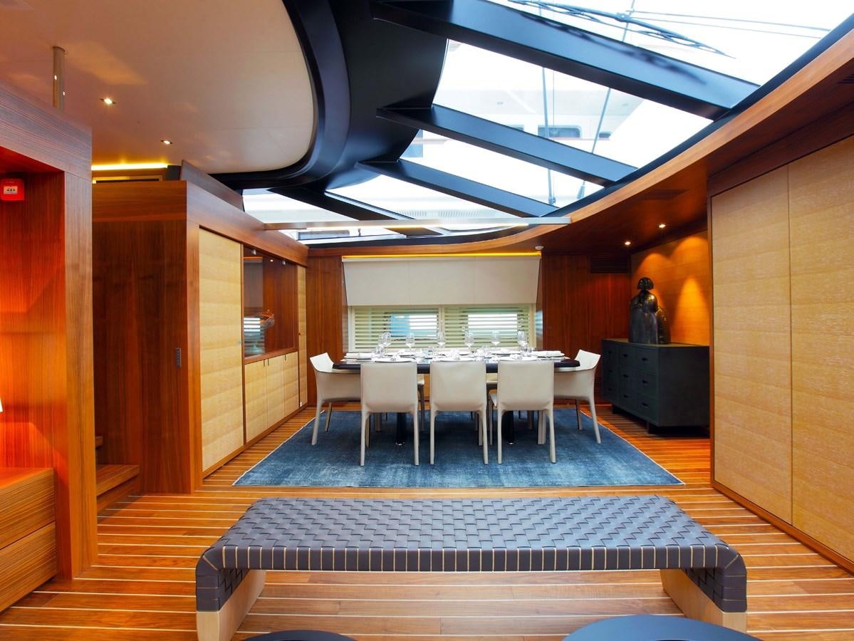 a room with tables and chairs aboard STATE OF GRACE Yacht for Charter