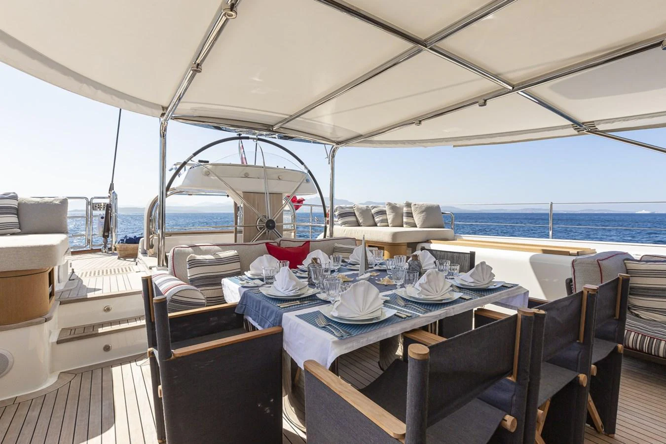 a boat with a table and chairs aboard STATE OF GRACE Yacht for Sale