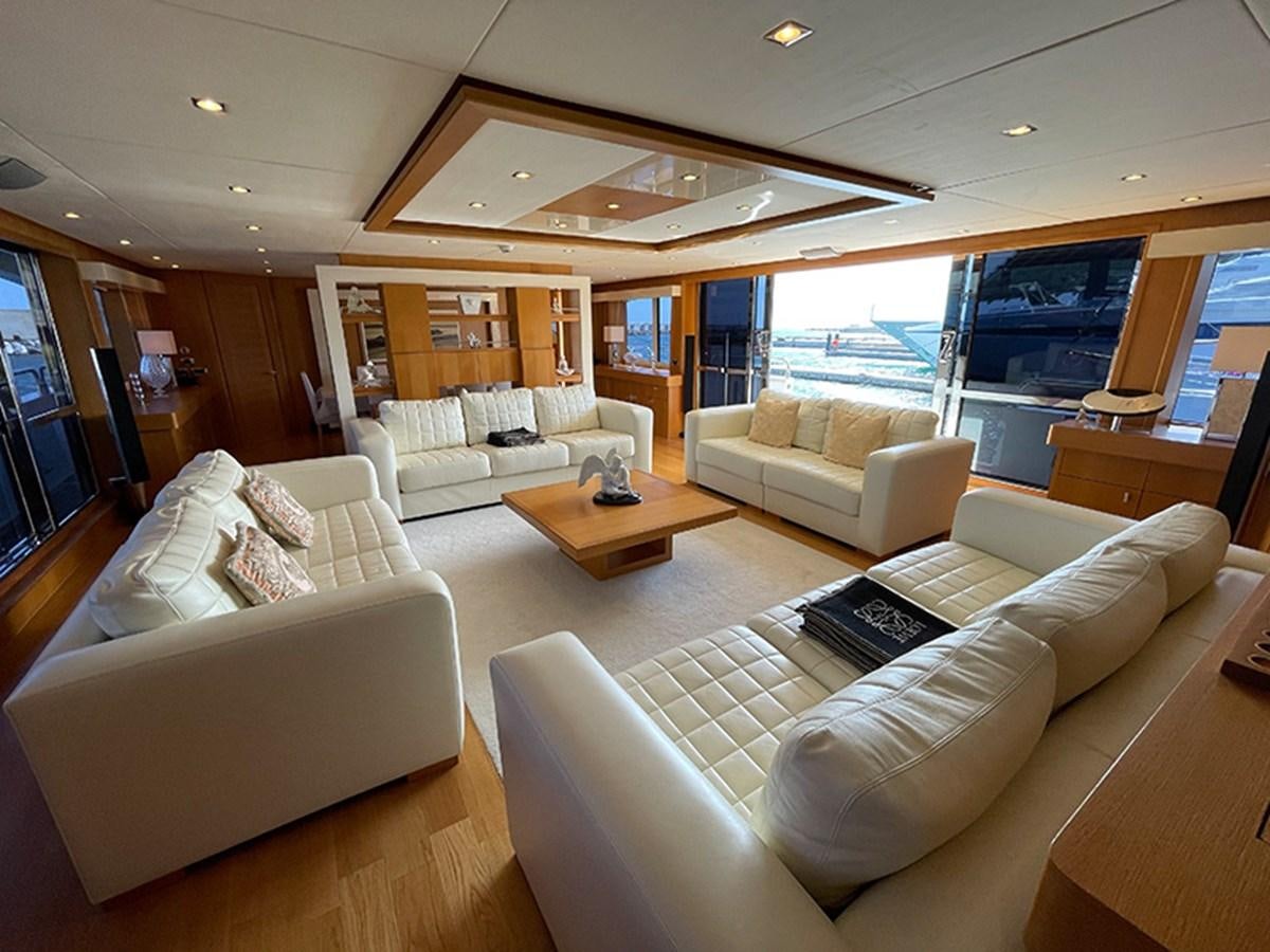 a living room with a large window aboard EVIL ZANA Yacht for Sale
