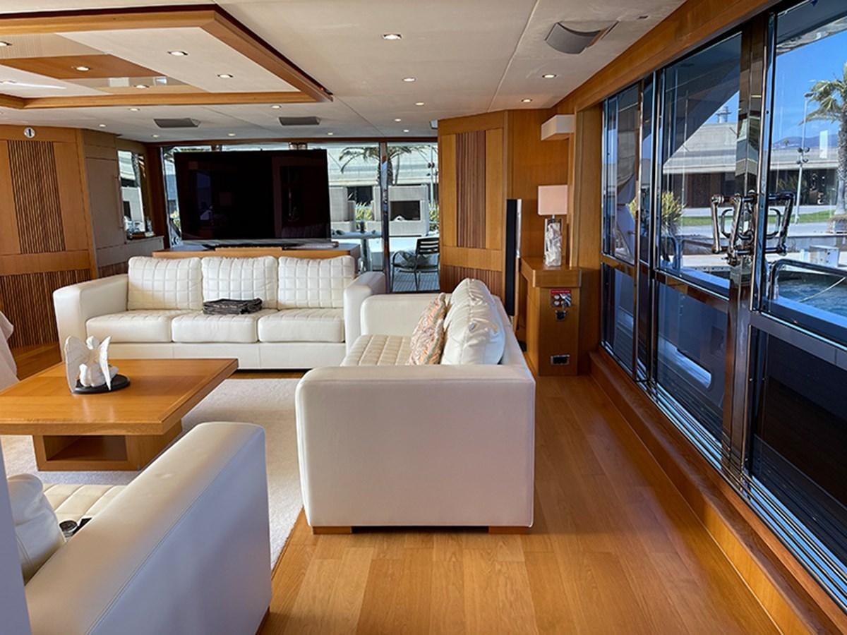 a living room with a large window aboard EVIL ZANA Yacht for Sale