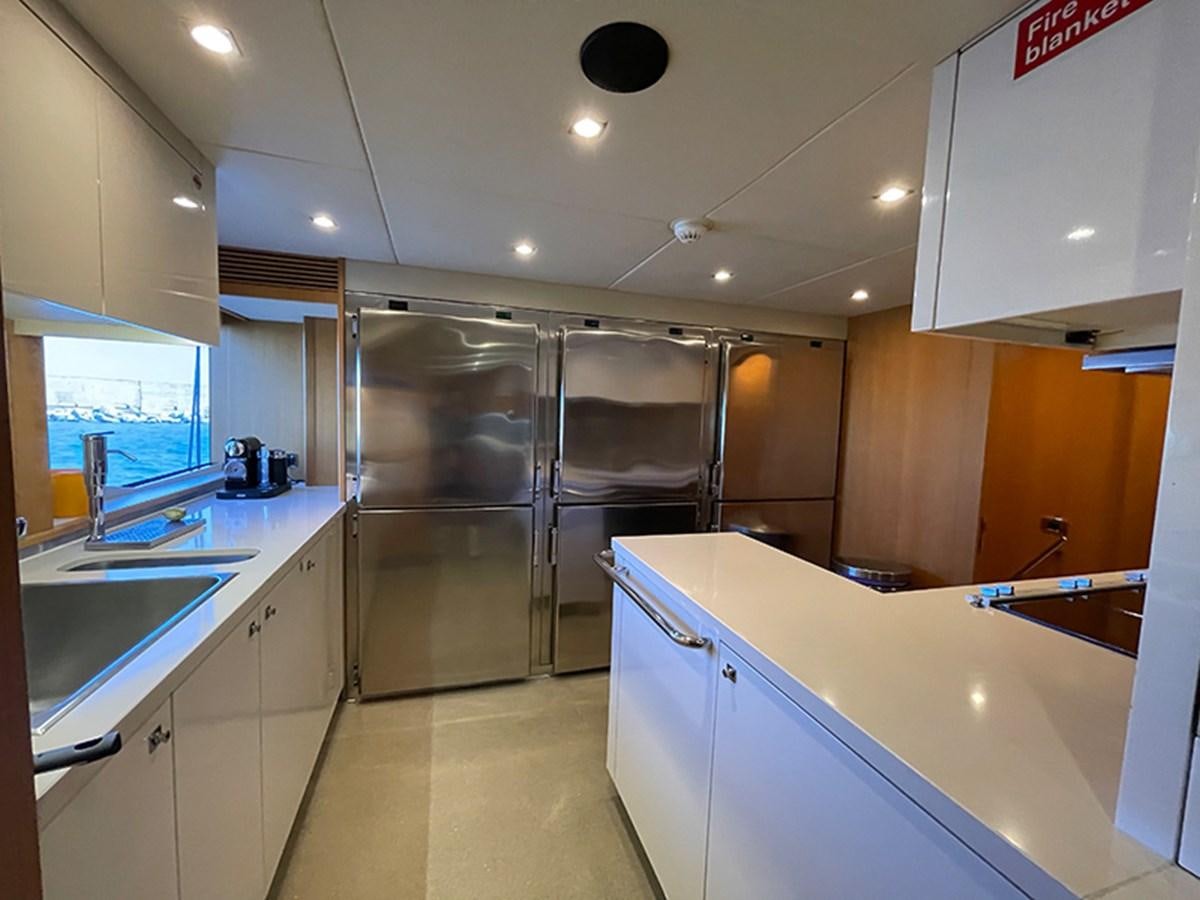 a kitchen with a glass shower aboard EVIL ZANA Yacht for Sale