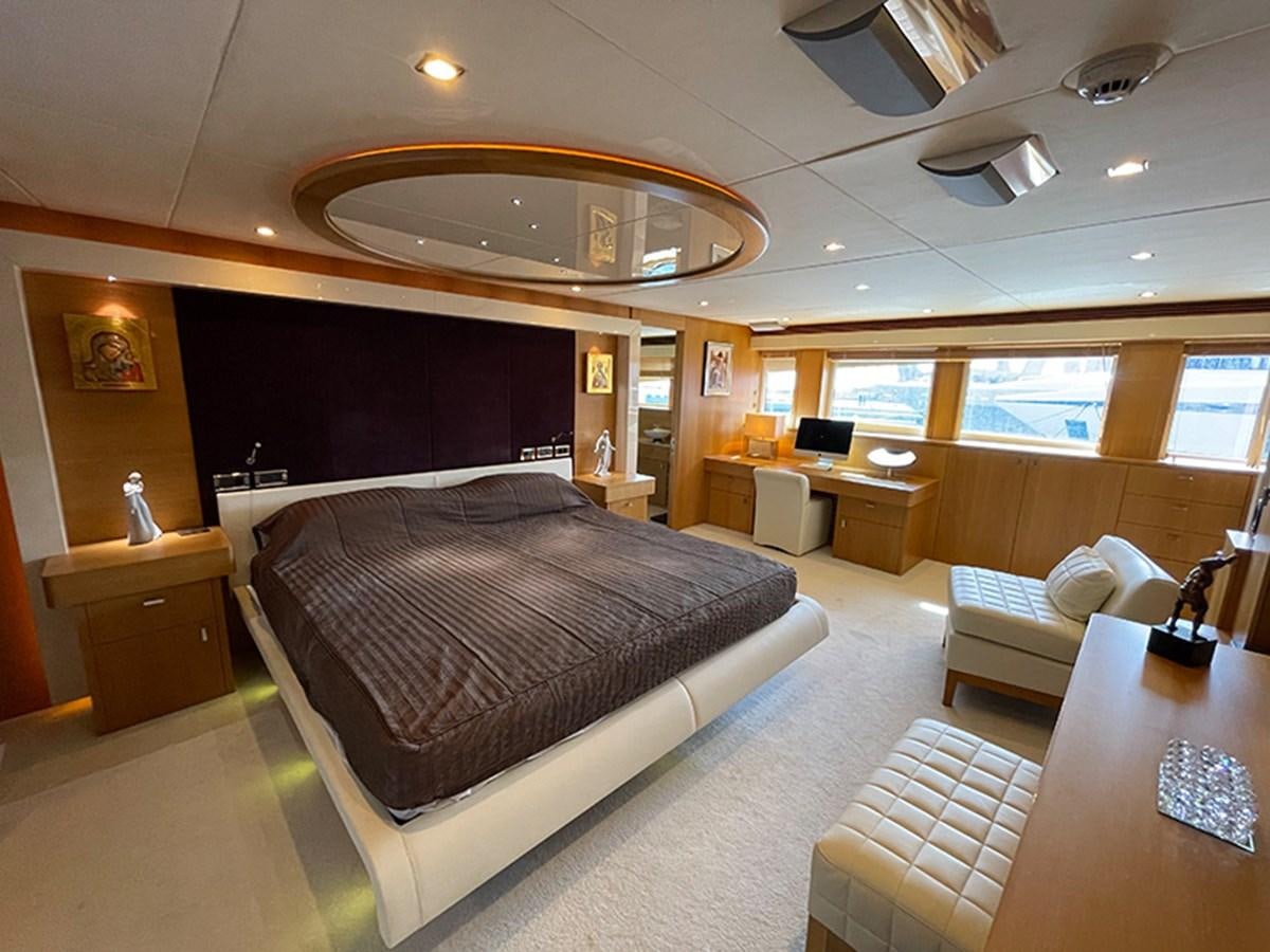 a large bedroom with a large bed aboard EVIL ZANA Yacht for Sale
