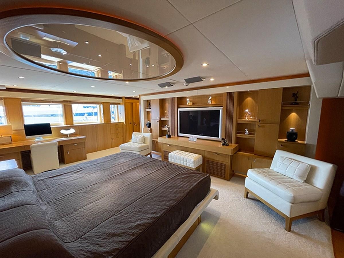 a large bedroom with a large bed aboard EVIL ZANA Yacht for Sale