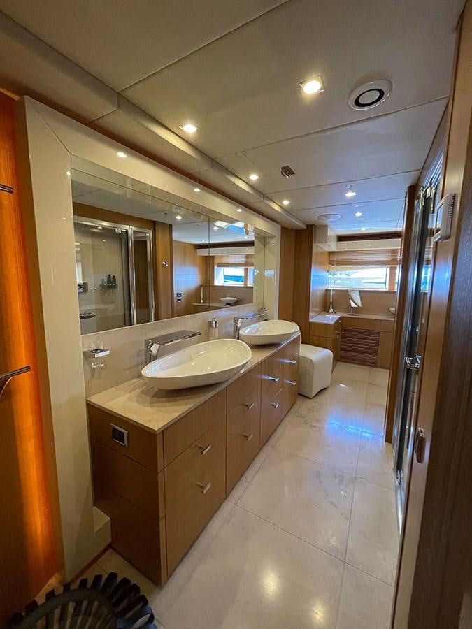 a bathroom with a sink and a mirror aboard EVIL ZANA Yacht for Sale