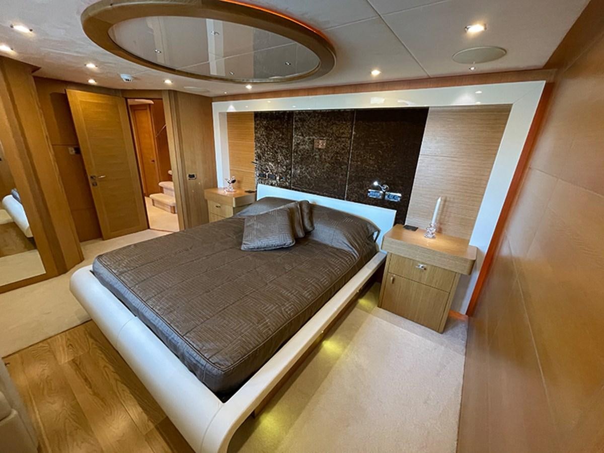 a large bed in a hotel room aboard EVIL ZANA Yacht for Sale