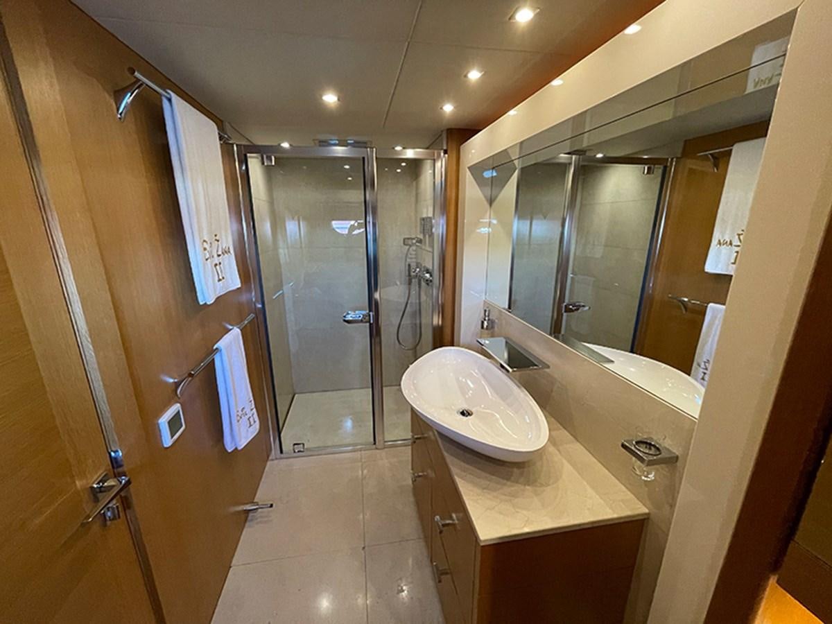 a bathroom with a sink and a shower aboard EVIL ZANA Yacht for Sale