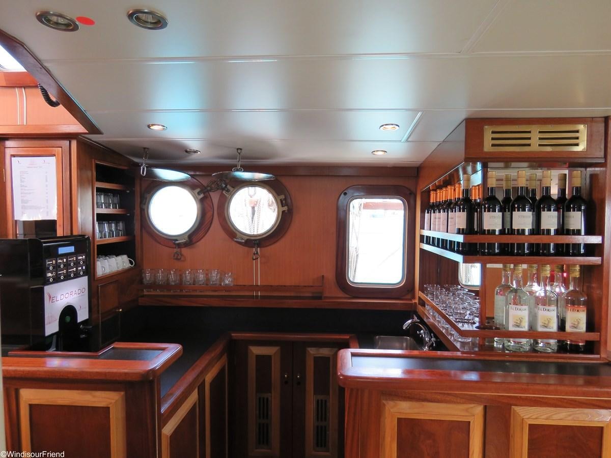 a bar with a large clock aboard ELDORADO Yacht for Sale
