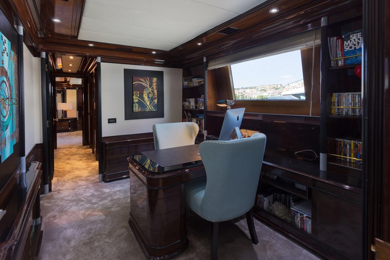 a room with a desk and a computer aboard INDIGO STAR I Yacht for Charter