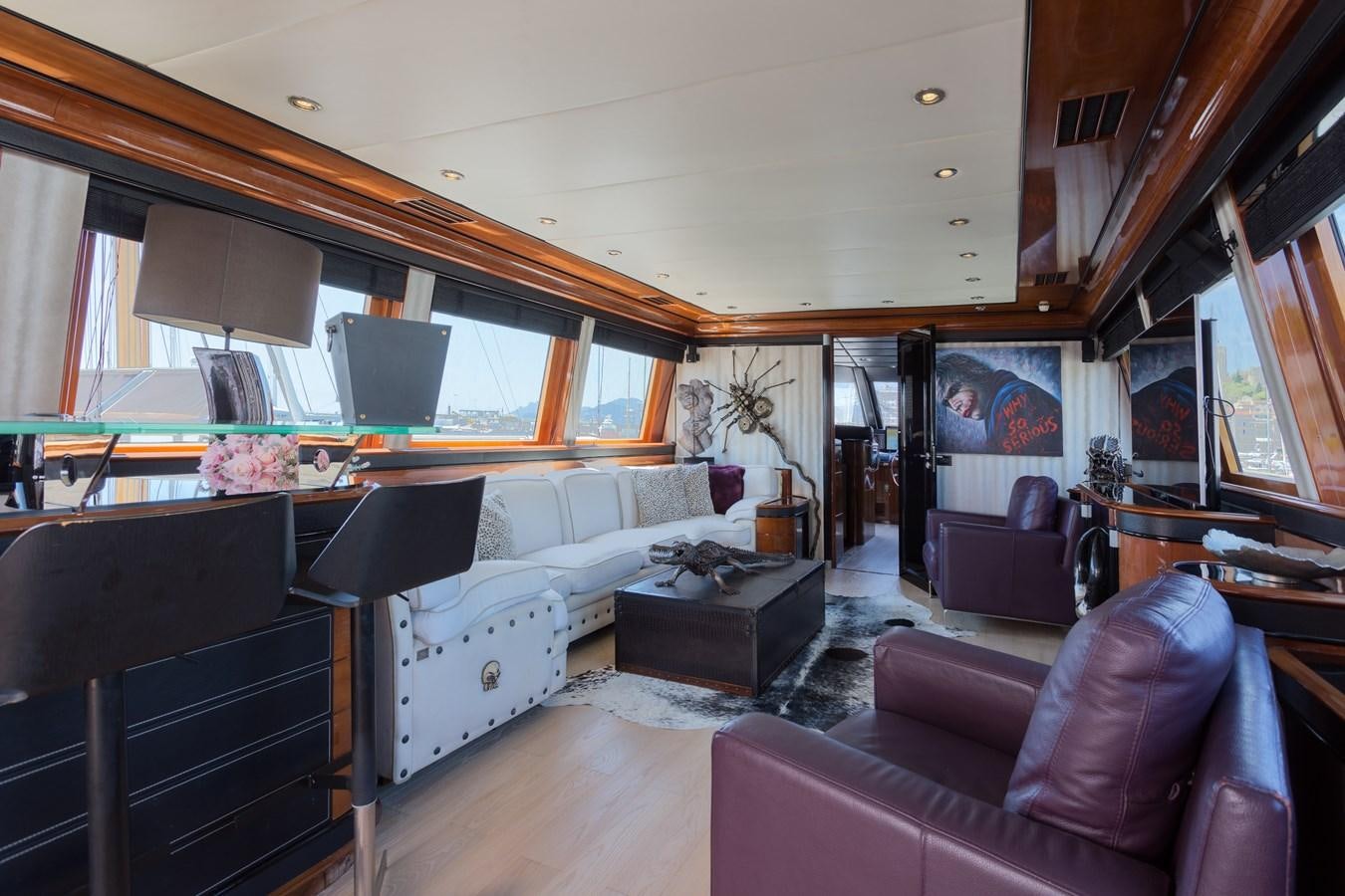 a living room with a piano aboard INDIGO STAR I Yacht for Charter
