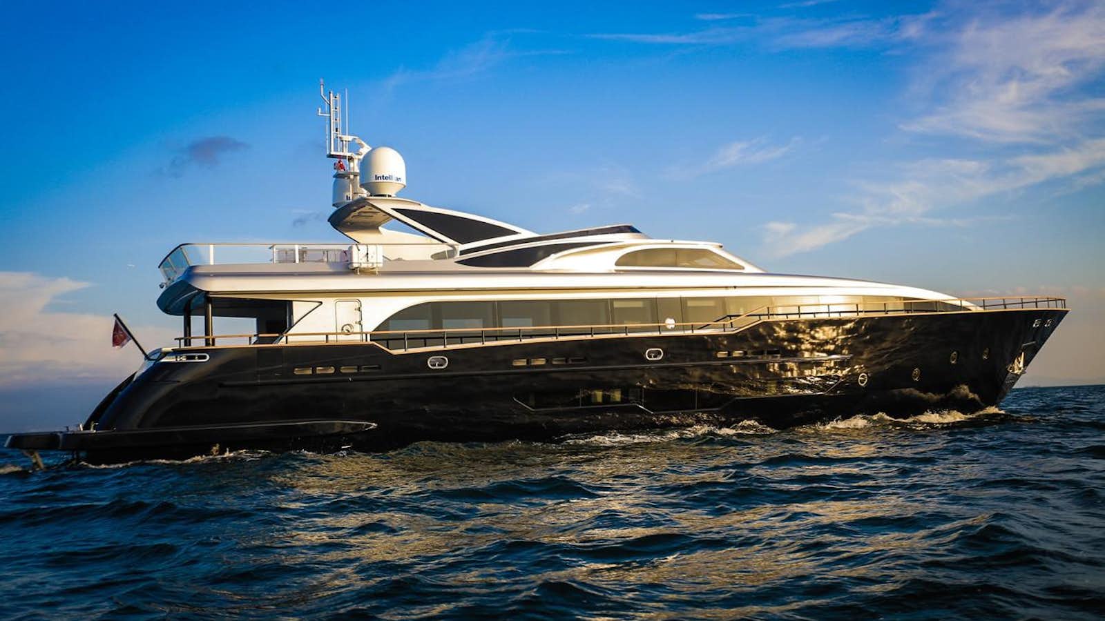 a large ship in the water aboard M/Y HARUN Yacht for Sale