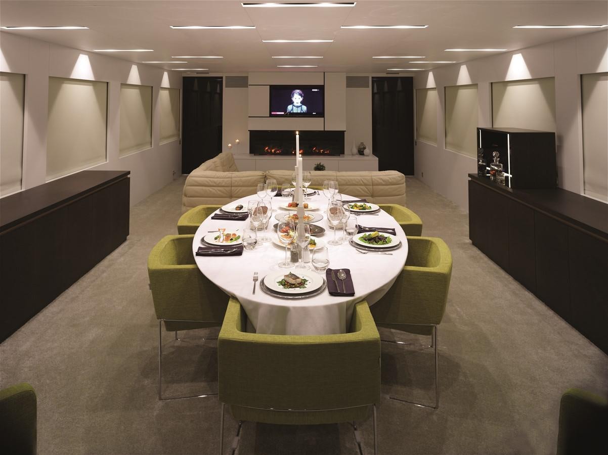 a table with a plate and chairs aboard HARUN Yacht for Sale