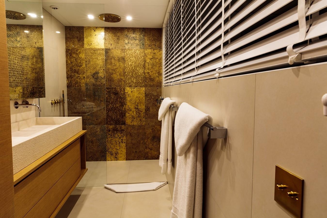 a bathroom with a shower curtain aboard HARUN Yacht for Sale