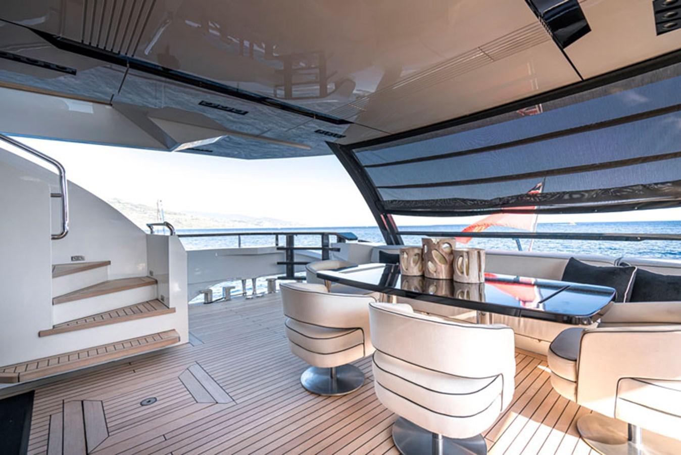a boat with a table and chairs aboard SAFFURIYA Yacht for Sale