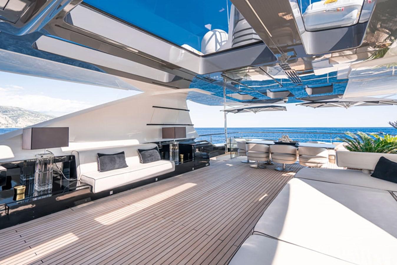a deck with a large boat in the background aboard SAFFURIYA Yacht for Sale