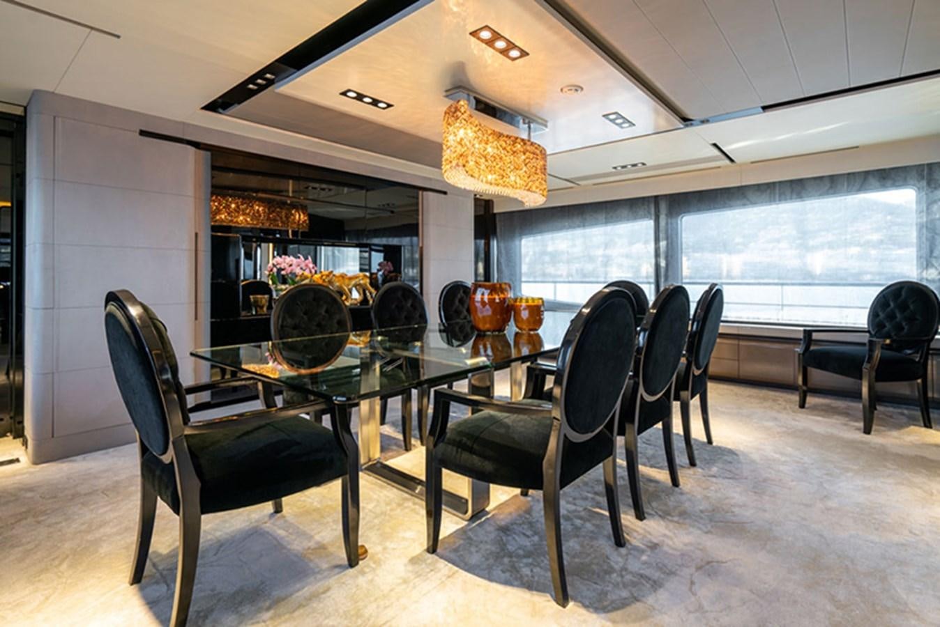 a table and chairs in a room aboard SAFFURIYA Yacht for Sale