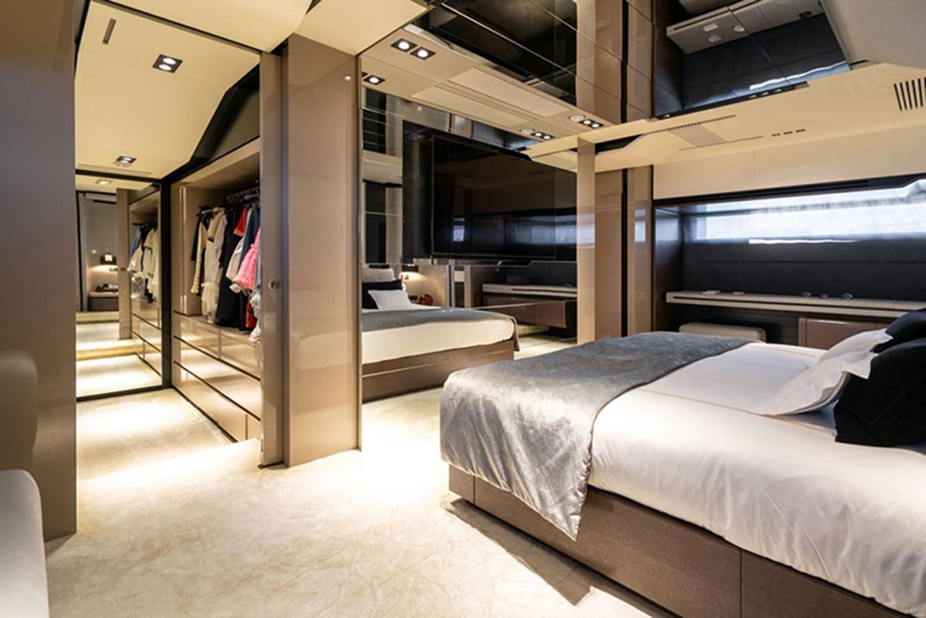 a room with beds and a large mirror aboard SAFFURIYA Yacht for Sale