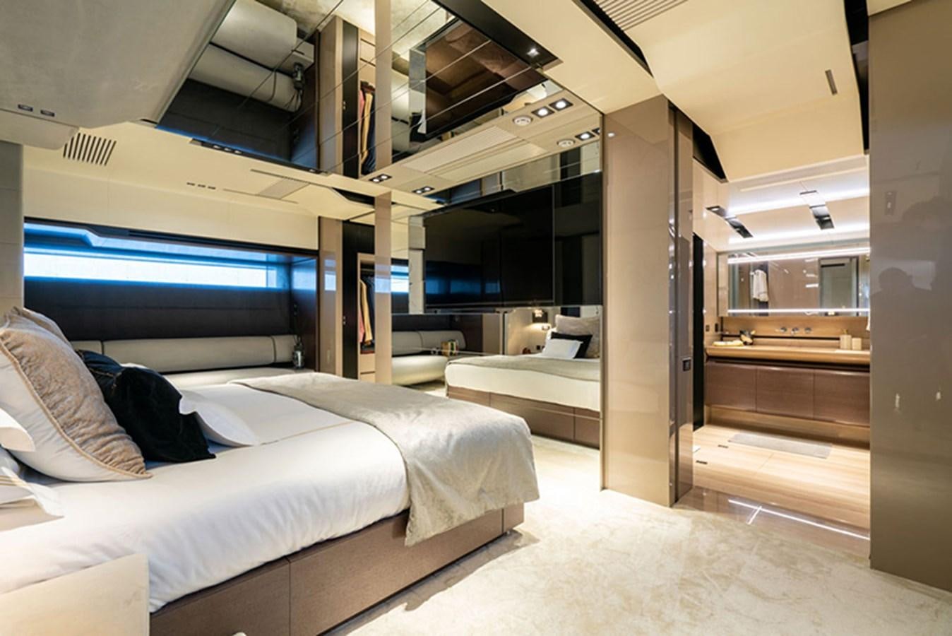 a room with beds and a large window aboard SAFFURIYA Yacht for Sale