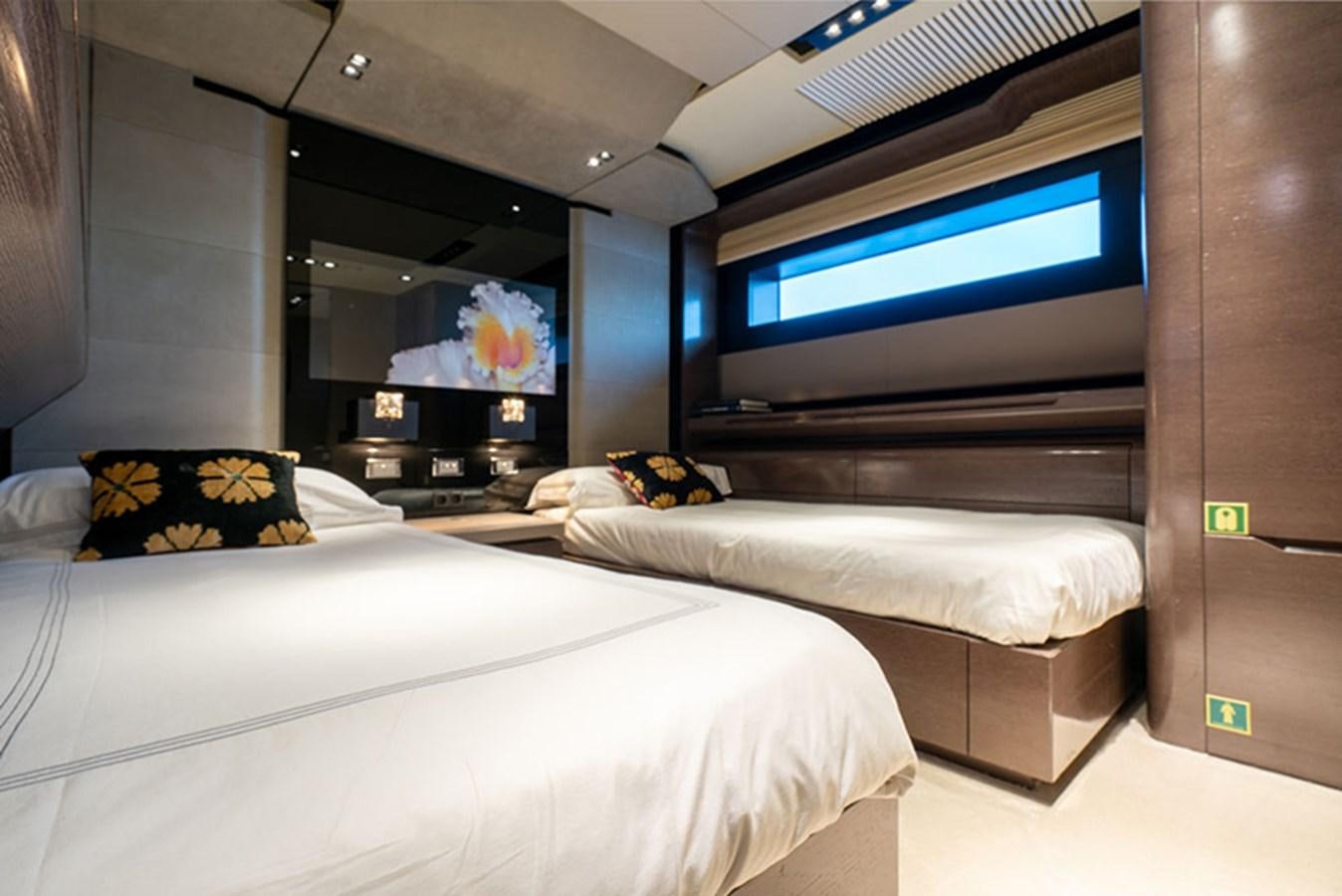 a room with beds and tv aboard SAFFURIYA Yacht for Sale
