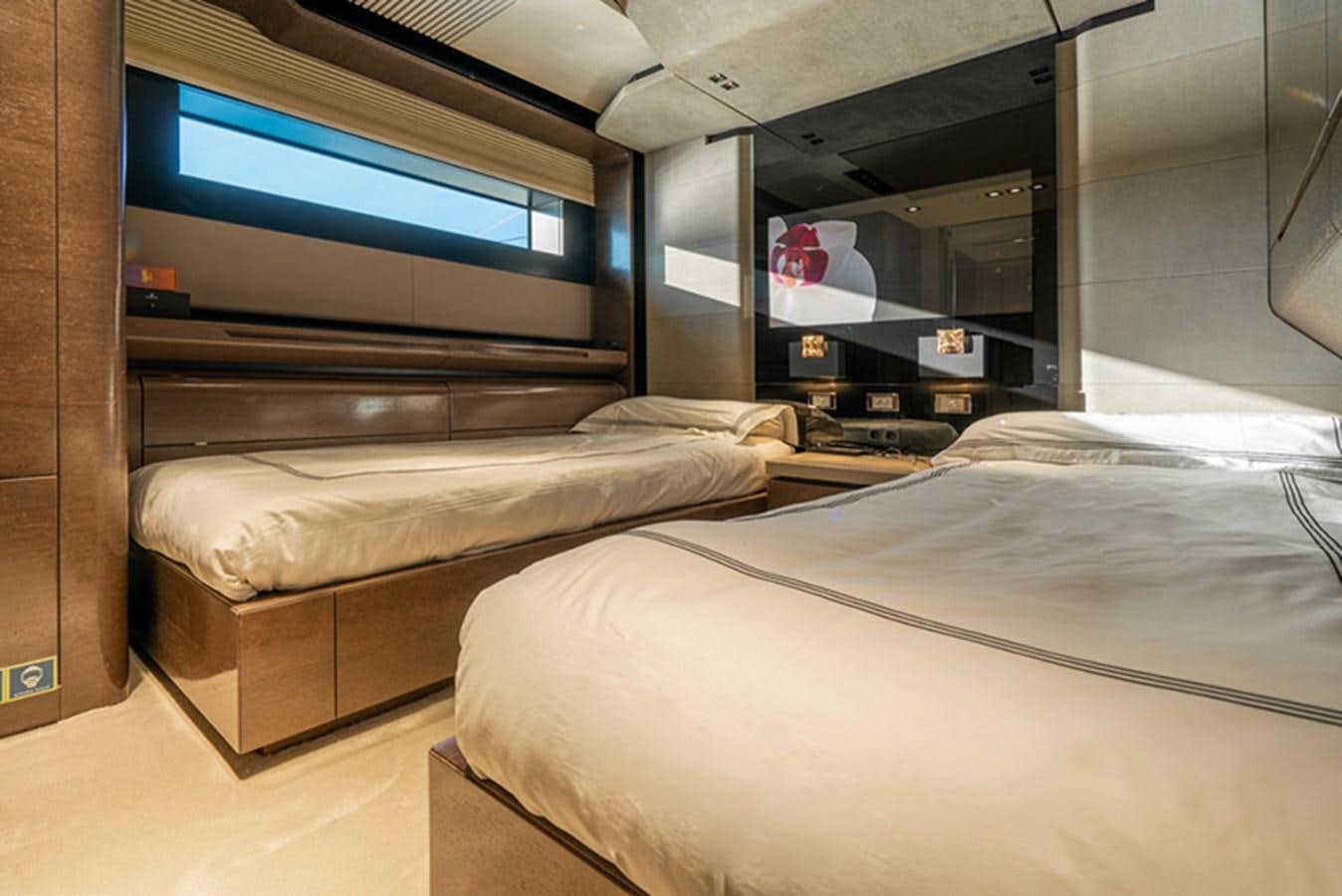 a room with beds and tv aboard SAFFURIYA Yacht for Sale