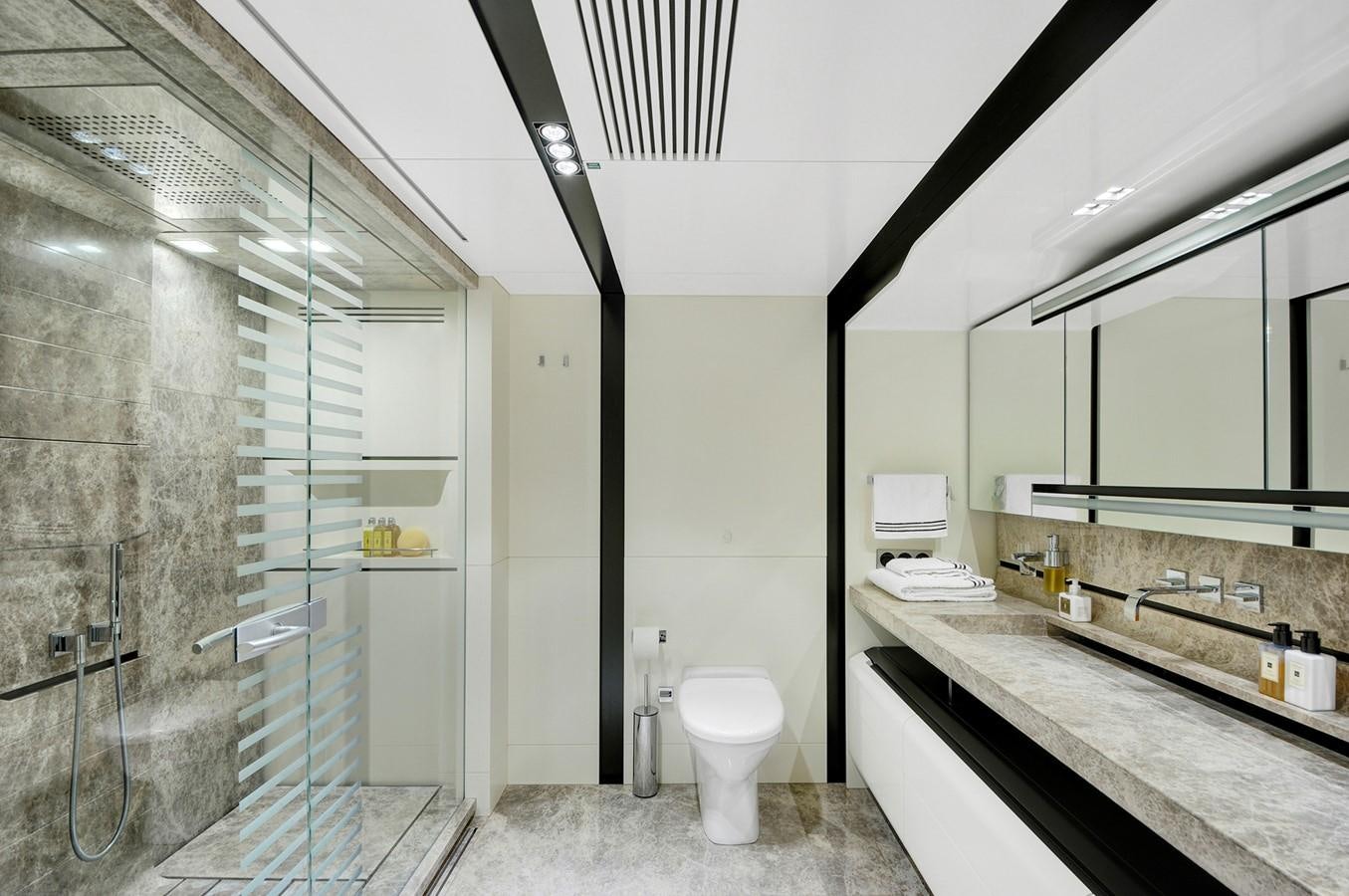 a bathroom with a glass shower aboard FX Yacht for Charter