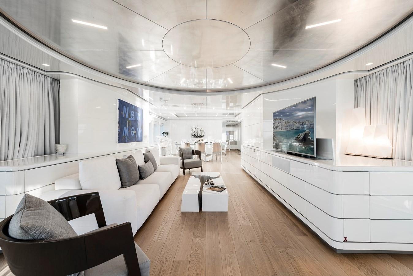 a room with a couch and a table and chairs aboard ANGKALIA Yacht for Sale