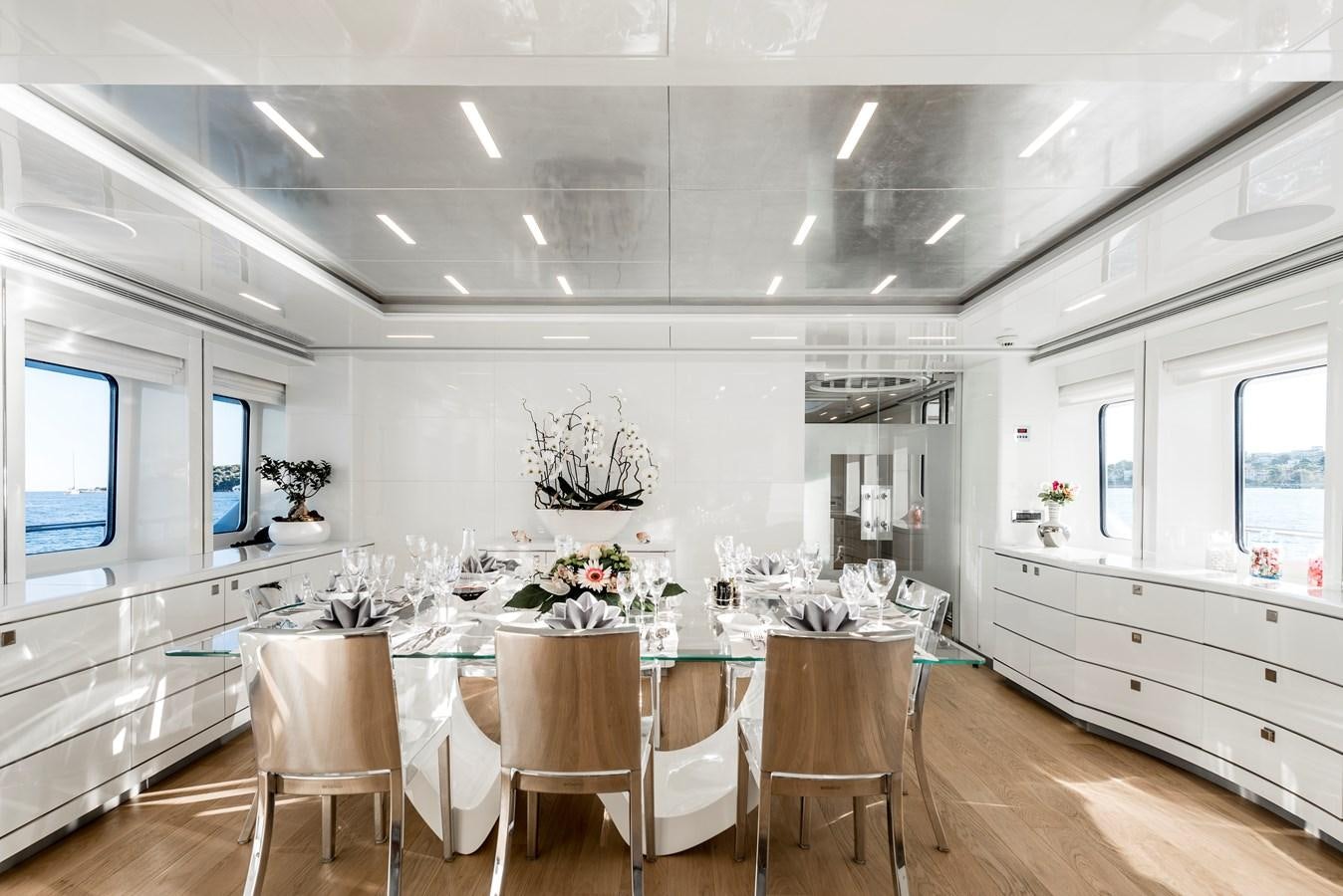 a large kitchen with white cabinets aboard ANGKALIA Yacht for Sale