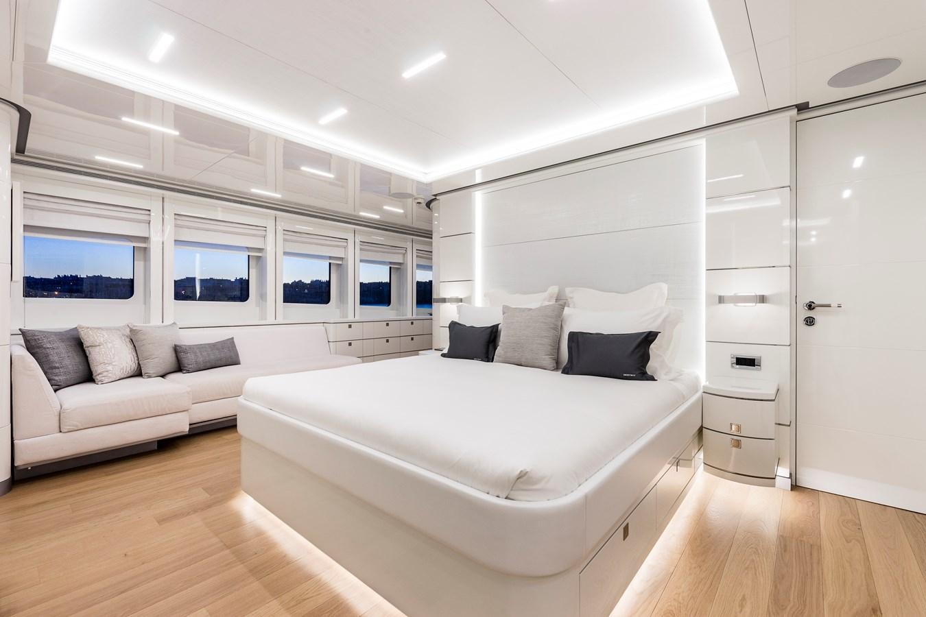 a room with a bed and a couch aboard ANGKALIA Yacht for Sale