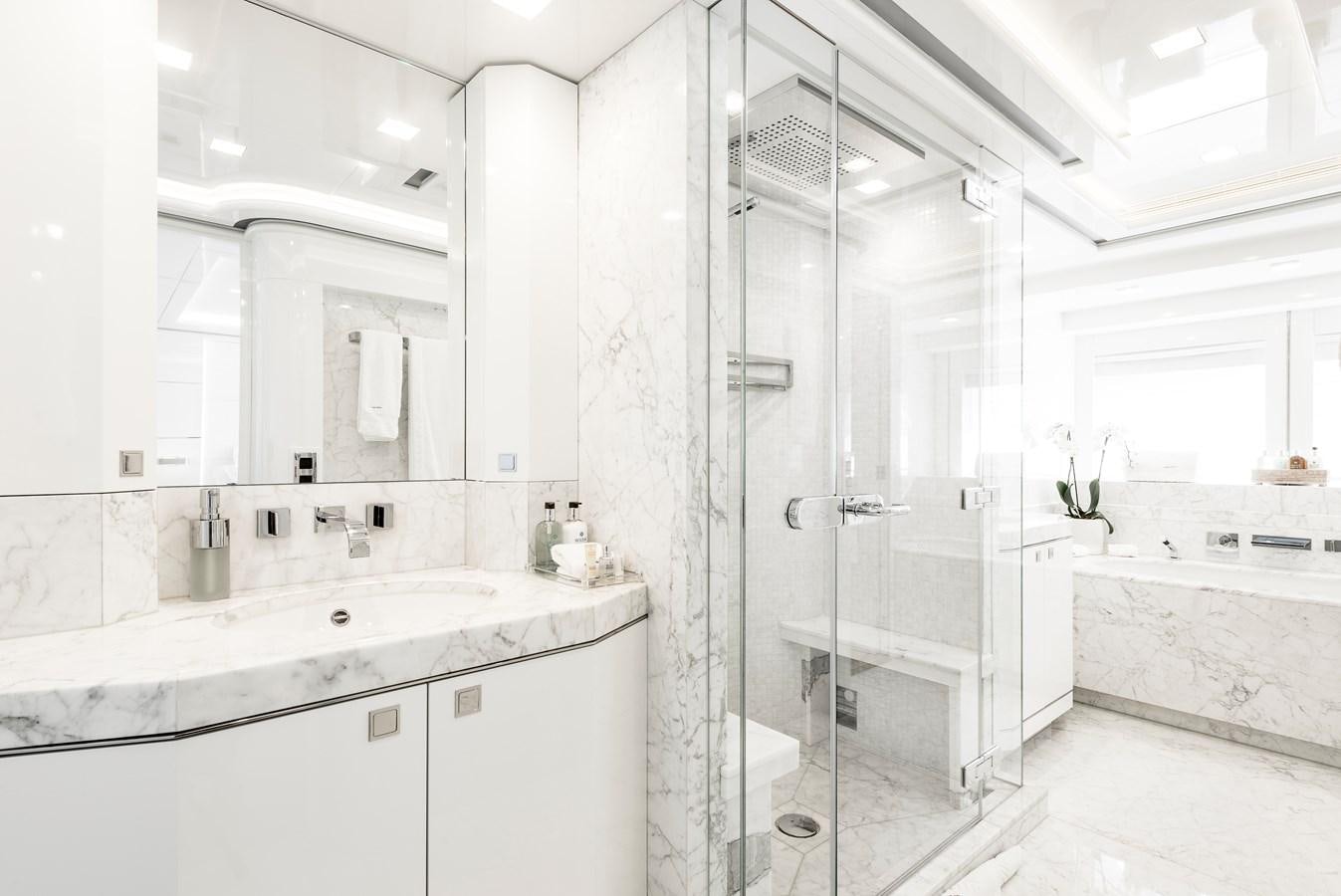 a bathroom with a shower unit and sink aboard ANGKALIA Yacht for Sale