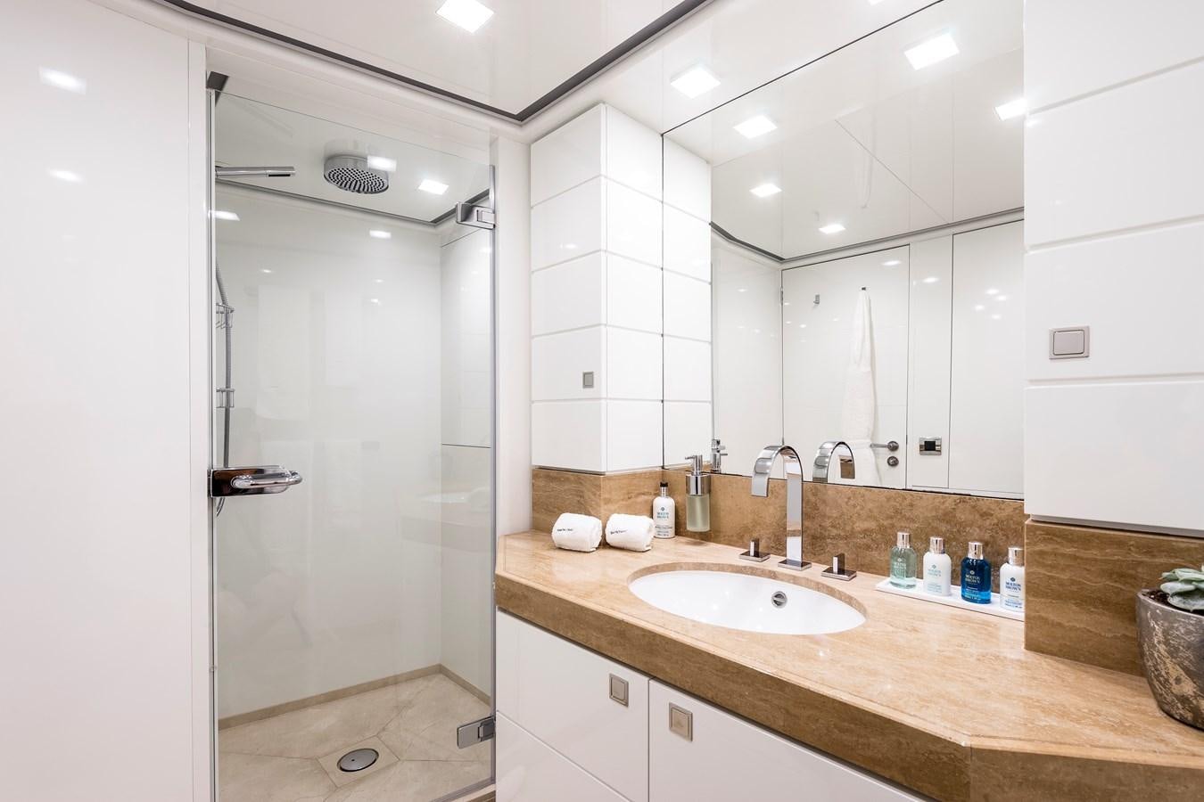 a bathroom with a sink and a shower aboard ANGKALIA Yacht for Sale
