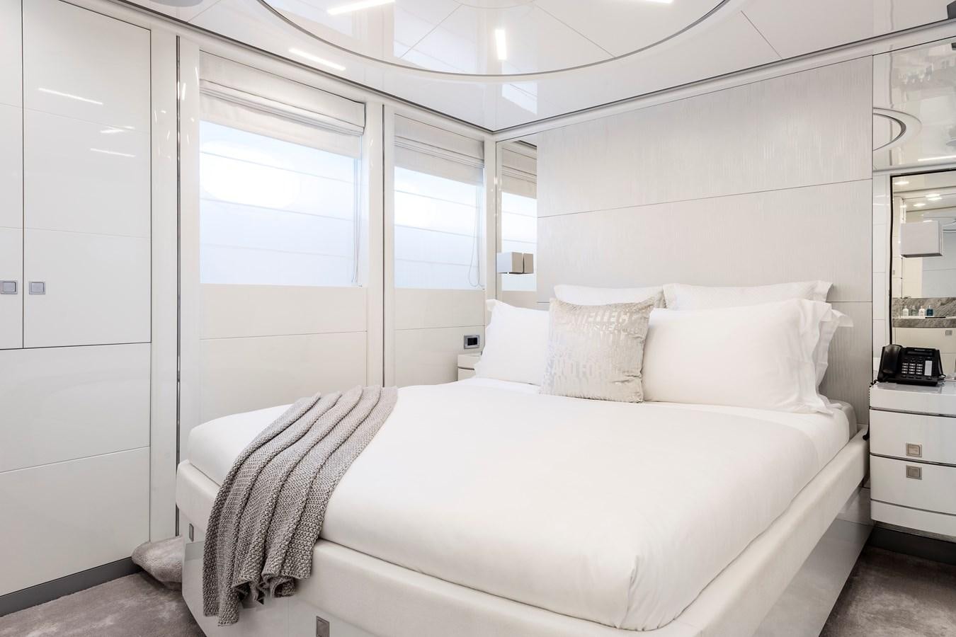 a bed with white sheets aboard ANGKALIA Yacht for Sale