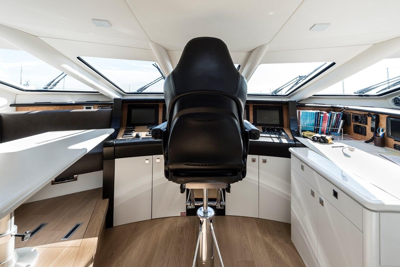 a black chair in a room aboard ANGKALIA Yacht for Sale