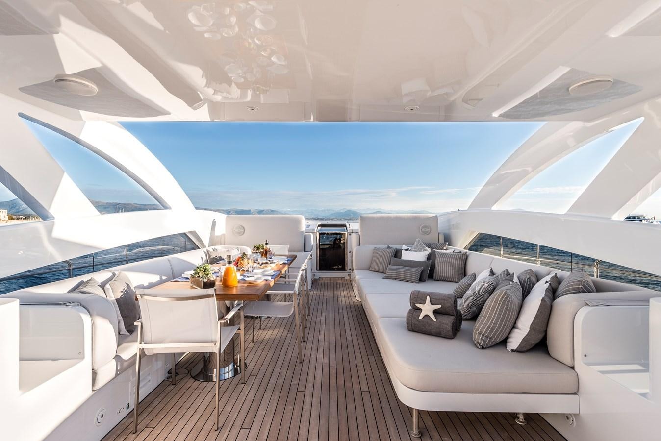 a large living room with a large swimming pool aboard ANGKALIA Yacht for Sale