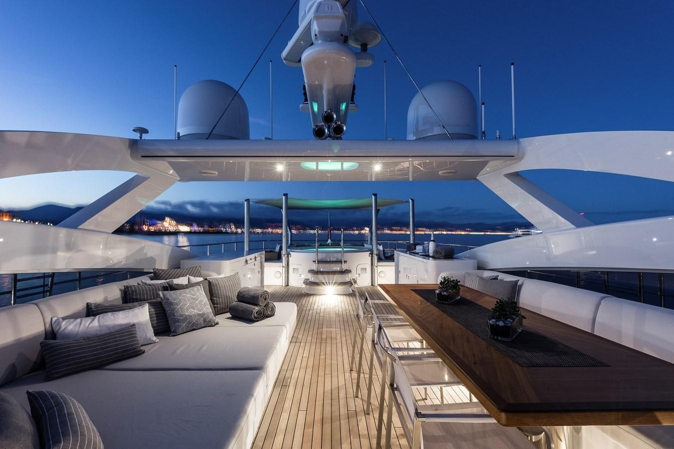 a room with a couch and a pool aboard ANGKALIA Yacht for Sale