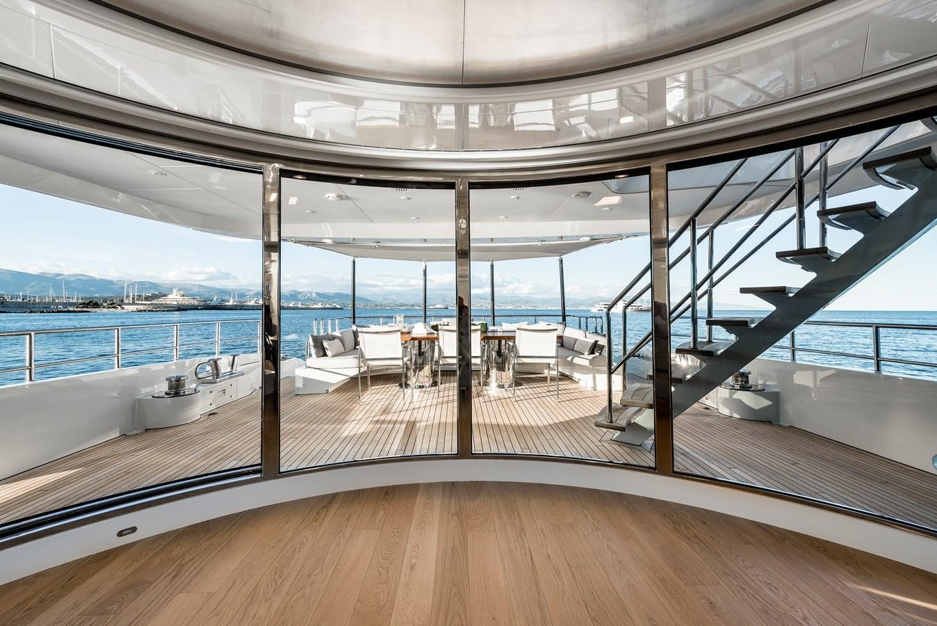 a deck with a view of the ocean and the deck aboard ANGKALIA Yacht for Sale