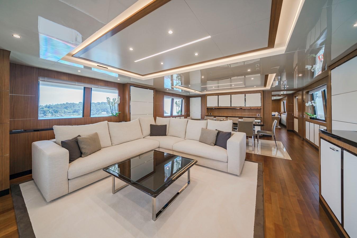 a living room with a couch and a coffee table aboard FIORENTE Yacht for Sale