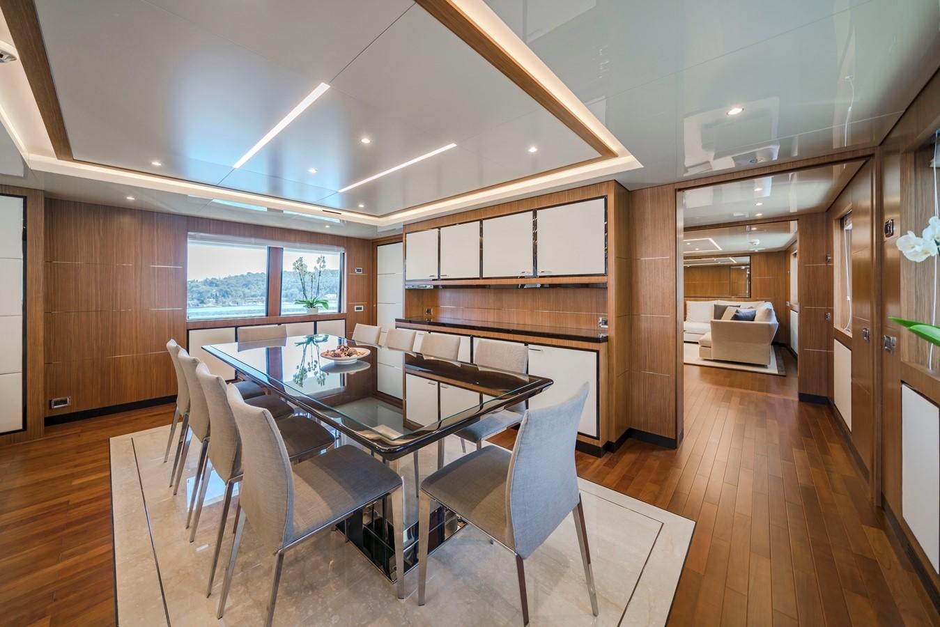 a room with a table and chairs aboard FIORENTE Yacht for Sale